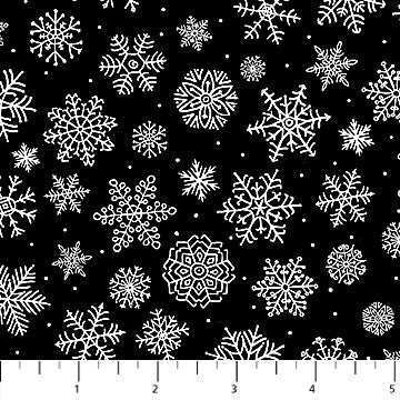 24736-99 $16.60/yd White snowflakes on black