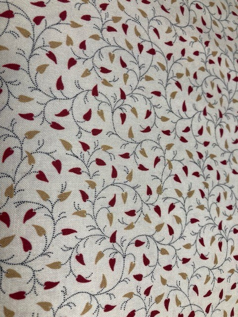 570176 $17.99/yd  Gold and Rust heart shaped leaves on a Vine on Cream Background