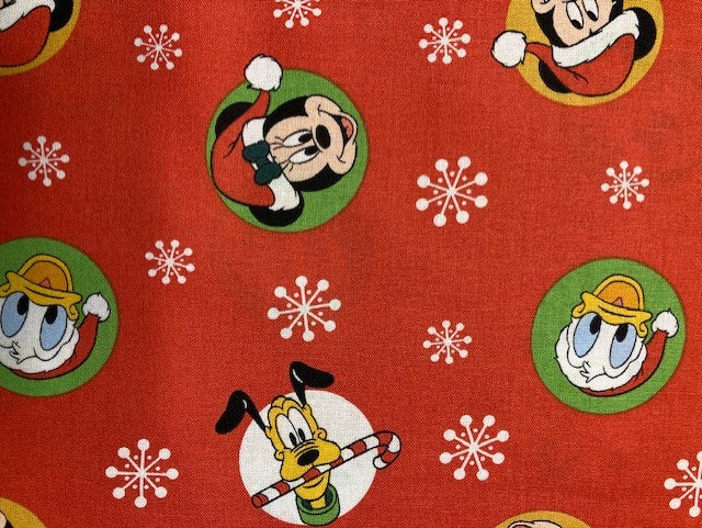 22024 $17.95/yd Mickey and Friends Christmas Badges.