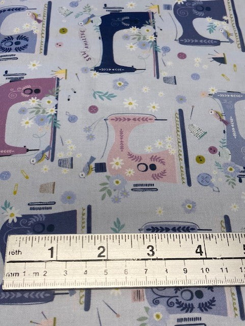 D2180 $18.45/YD Colourful sewing machines on pale blue background